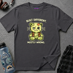Text "Built Different, Mostly Wrong" green teddy bear poorly stitched and patched together with mismatched parts