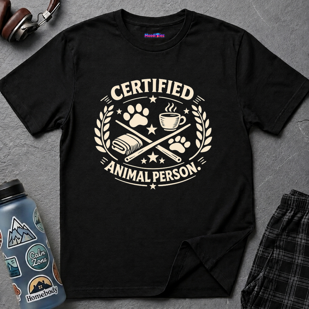 Emblem showing paw prints and coffee cup around CERTIFIED ANIMAL PERSON text in circular stars and leaves laurel