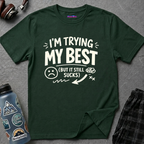 Text "I'm Trying My Best (But It Still Sucks)" in bold white font with a sad face and chaotic doodles.