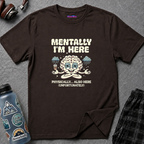 Text "Mentally I'm Here. Physically … Also Here (Unfortunately)" with burned-out brain sitting in meditation pose with a coffee cup under a rainy night sky.