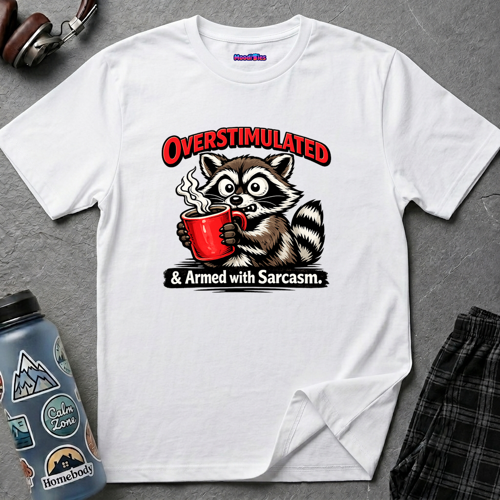 Text "Overstimulated & Armed with Sarcasm" with a wired and frazzled cartoon raccoon grasping steaming red coffee cup.