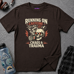 Text "Running on Caffeine Chaos & Trauma" biker-style design of skull with glowing red eyes enjoying a steaming cup of coffee.