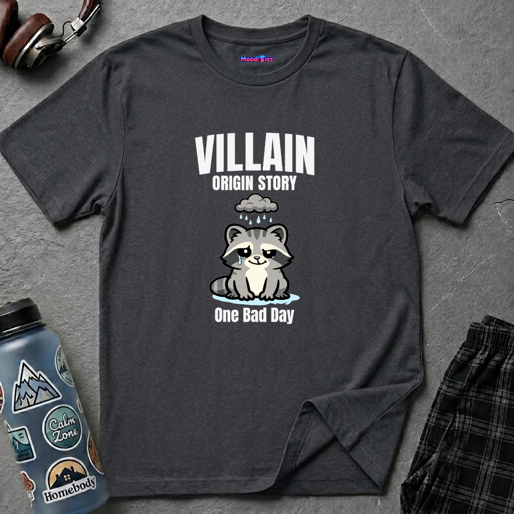 Text "Villain Origin Story" over a sad and mad raccoon being rained on by a tiny rain cloud over its head, with text "One Bad Day"underneath